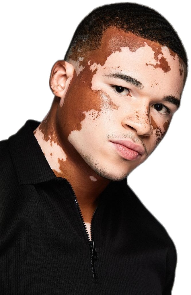 Portrait of the same creator in a black top
